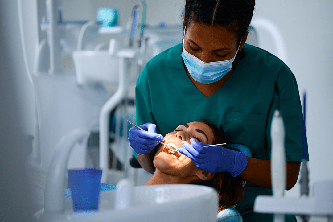 young-woman-getting-her-teeth-checked-by-black-fem-2024-12-13-20-50-30-utc