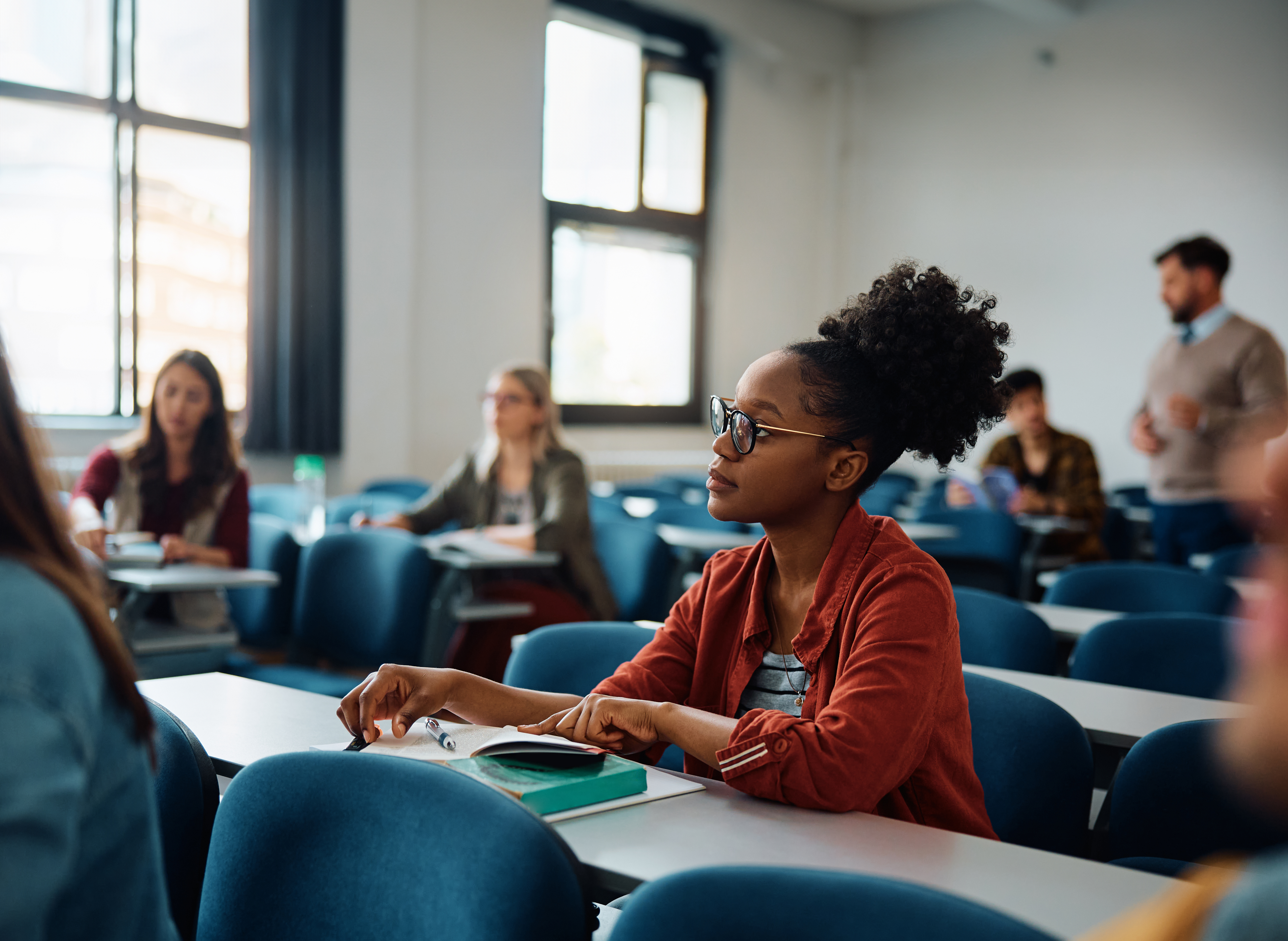 young-black-student-paying-attending-during-a-clas-2024-12-13-17-53-07-utc